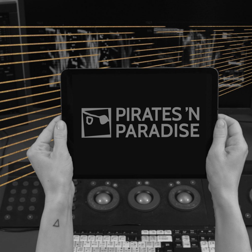 Tablet showing "Pirates 'N Paradise"